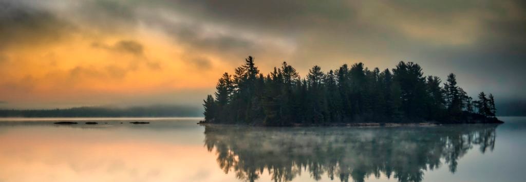 Misty island in lake at sunset Photo: Ontario Tourism