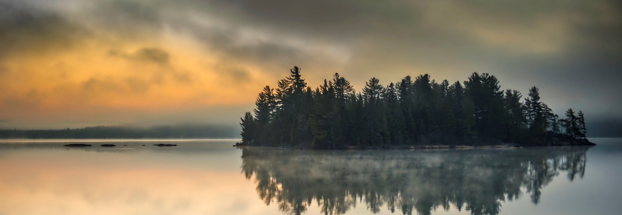 Misty island in lake at sunset Photo: Ontario Tourism